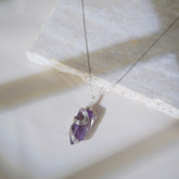 High clarity amethyst pendant with silver wire craftsmanship